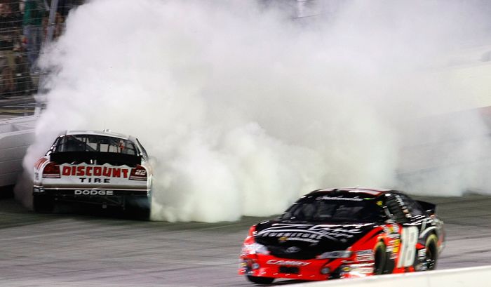 Kyle Busch drives by Brad Keselowski after the two made contact in Turn 4 of Lap 218. Busch won for the 10th time of the season, tying the NASCAR Nationwide Series record held by Sam Ard and Busch (in 2008). Credit: Geoff Burke/Getty Images for NASCAR
